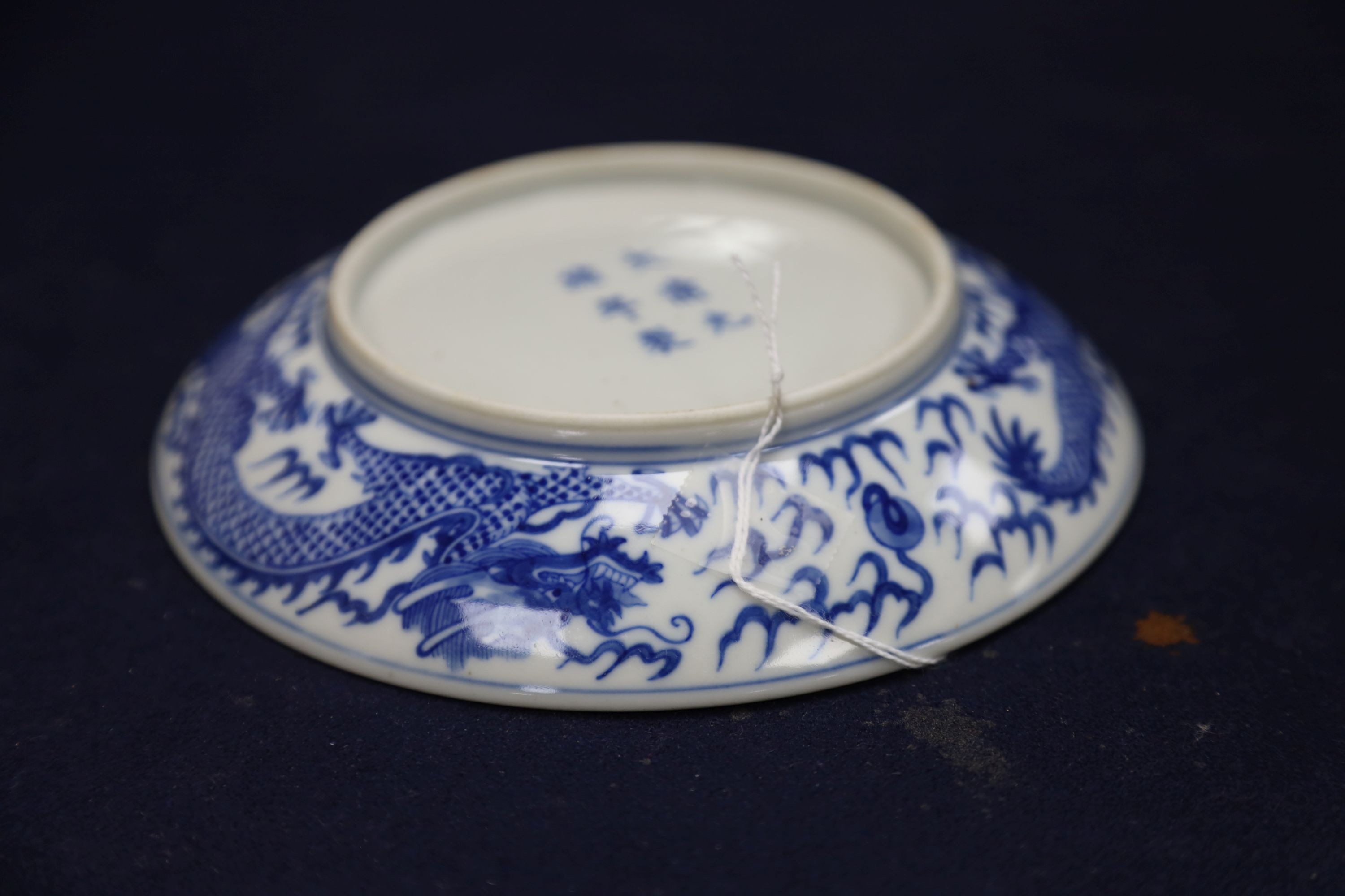 A Chinese blue and white landscape bowl, a/f and a Chinese blue and white 'dragon' dish, 18cm and 16.5cm